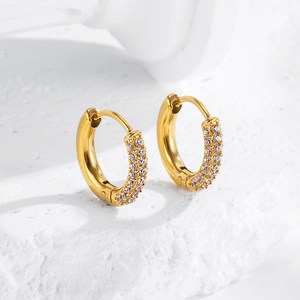 Macro view of gold hoop earrings with three rows of micro-pave white zircon stones