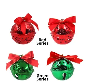 Detailed macro of festive red and green metal bells with Noel and Peace engravings