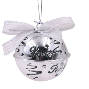 Macro shot of silver metal bell with Peace engraving and white silk bow detail