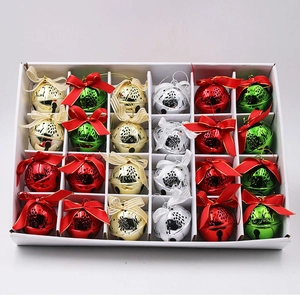 Close-up of 24-piece colorful metal Christmas bells with Noel text in a gift box