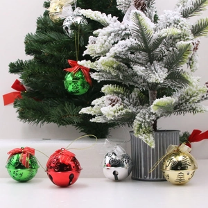 Plated metal Christmas bells with hollow patterns and bows for festive tree decoration