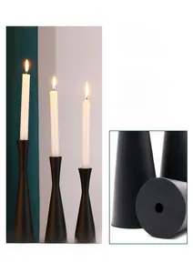 Detail of matte black metal candle holder featuring a reinforced iron base for stability