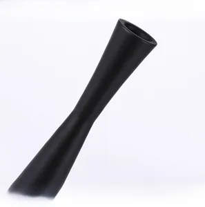 Detail of matte black candle holder with elegant waist design and smooth frosted texture