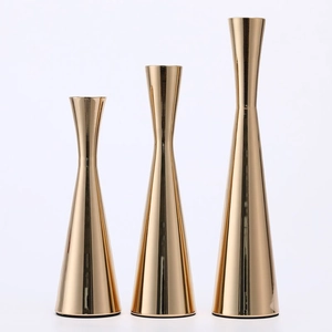 Three-piece gold electroplated metal candlestick set with sleek minimalist conical bases