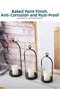 Three-piece black metal candle holders with glass inserts and protective paint finish