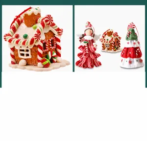 Detailed view of handmade Christmas clay cabin, angel and tree ornaments for festive decor