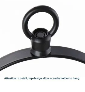 Close-up of matte black wrought iron candle holder with top ring for hanging