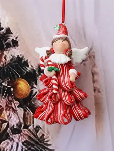 Detailed close-up of a Christmas angel ornament with red stripes and white wings