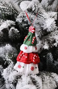 Detailed view of polymer clay Christmas ornament with peppermint and candy cane patterns