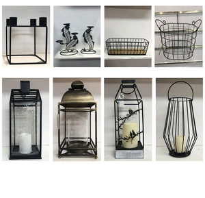 Collection of black iron geometric candle holders and vintage lanterns for home decor