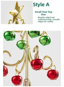 Detail der goldenen Metallsternspitze und glatten roten Glocken am Mini-Weihnachtsbaum