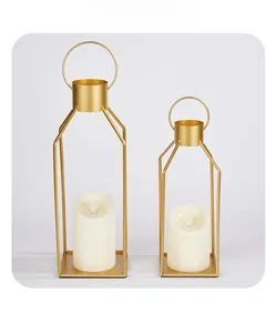Detailed view of exquisite gold plated metal candle holders with internal LED candles