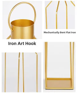 Detailed view of golden metal candle holder showing top hook and curved iron craftsmanship