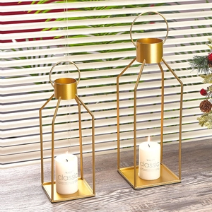 Modern set of two gold iron candle holders with geometric frames and ring handles