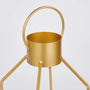 Modern gold iron candle holder with minimalist cylindrical cup and geometric metal stand