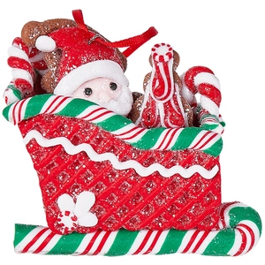 Zuckerbeschichteter Weihnachtsmann auf Zuckerstangen-Schlitten als Christbaumschmuck