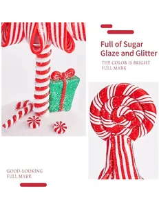 Detail eines weihnachtlichen Süßigkeitenbaums mit rot-weißen Streifen und Glitzer-Finish