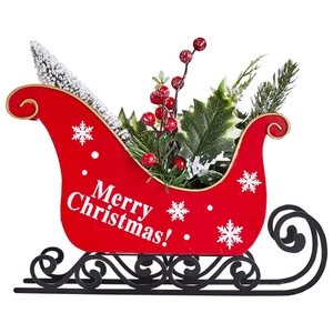Decorative red Christmas sleigh ornament with mini snowy tree and golden trim on white base
