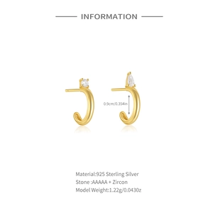 Detailed view of gold 925 sterling silver C-shaped earrings with AAAAA cubic zirconia stones