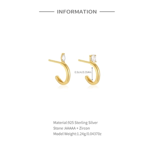 Detail view of S925 sterling silver J-shaped earrings with 18K gold and AAA cubic zirconia