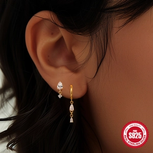 Elegant gold S925 sterling silver drop earrings with water drop shaped zircon on model