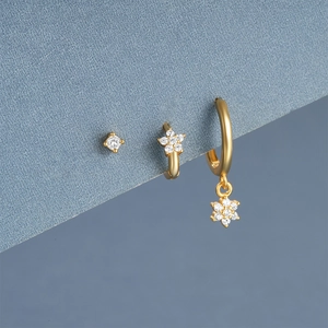 Detailed macro of S925 silver gold floral earring set with marquise zircon stones