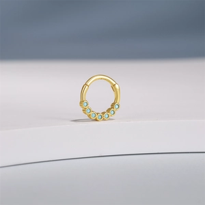 Detailed macro view of S925 hallmark on gold-plated ring with turquoise inlay