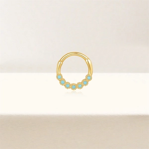 Detail of s925 silver gold hoop with marquise opal inlay and fine metal beadwork
