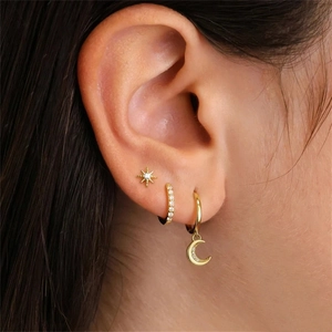 Detailed view of S925 silver gold star and moon earring set with sparkling zircon inlays