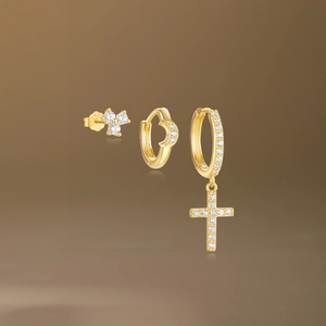 Detail view of S925 silver gold-plated earrings set with zircon moon and cross pendants