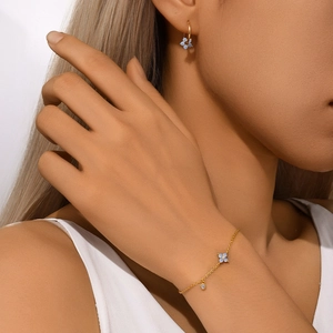 Detail of S925 silver blue opal four-leaf clover bracelet and matching flower earrings