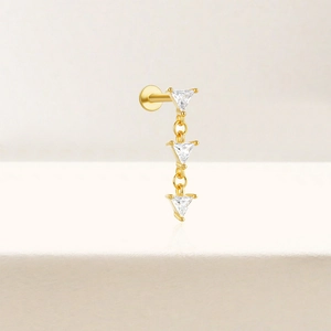 Macro detail of S925 sterling silver three-leaf clover stud with triple zircon stones