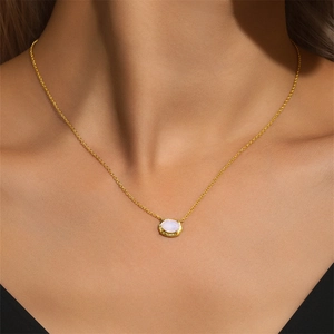 Close-up of a s925 sterling silver geometric pendant necklace with pink opal gemstone