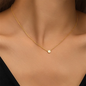 Detail of s925 silver starburst necklace with zircon on model for an elegant look