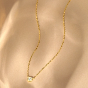 Detail shot of s925 silver star pendant necklace with zircon on champagne silk background