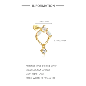 Close-up of 925 sterling silver heart cartilage stud with opal and cubic zirconia stones