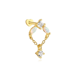 Detail of 925 sterling silver opal heart piercing with gold finish and zircon stones