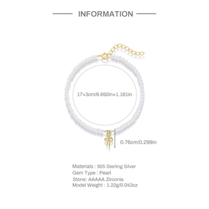 Makrodetail eines S925 Sterlingsilber-Bogenanhängers mit Perle und Zirkon auf dem Armband