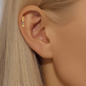 Detailed shot of S925 silver ear stud with yellow marquise and square cut zircons
