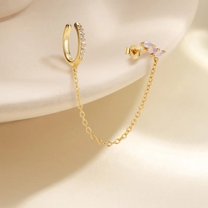 Detail of S925 silver 18K gold plated cuff earring with chain and marquise opal stone