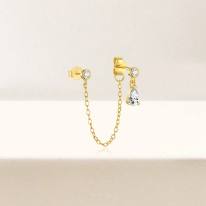 Macro shot of S925 sterling silver chain earrings with white zircon drop and stones