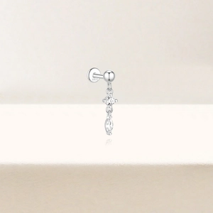 Macro shot of 925 silver flat back labret earring with round and marquise zircons