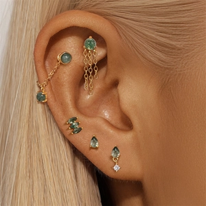 Detail of S925 silver gold chain earrings with green moss agate and sparkling zircons