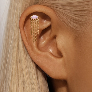 Detail of S925 silver gold ear stud featuring marquise opal and elegant chain tassels