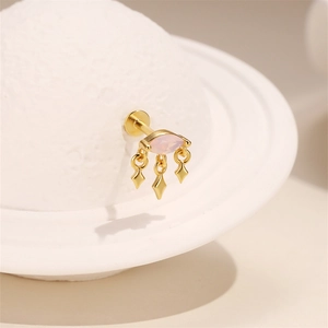 Detail of S925 silver opal piercing stud with three golden rhombus pendants and marquise gem