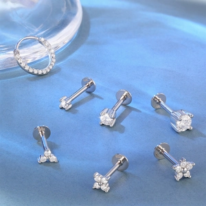 Macro detail of S925 sterling silver ear studs with sparkling moissanite stones