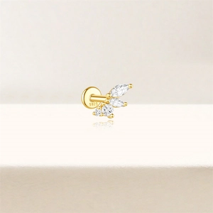 Macro view of S925 sterling silver gold labret stud with marquise and round white gems