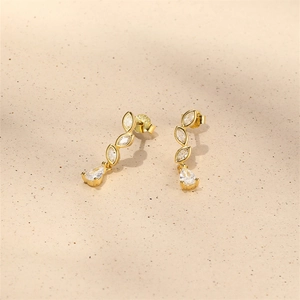 Close-up of S925 sterling silver stamp on gold earrings with marquise zirconia stones