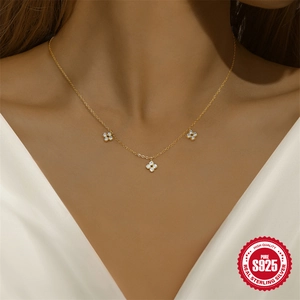 Elegant gold S925 sterling silver necklace with sparkling clover-shaped zircon pendants