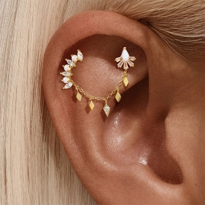 Detailed view of S925 silver ear crawler with gold chains and opal marquise zircons